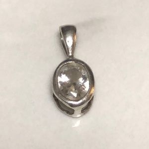 Oval CZ in 925 sterling silver basket setting‎